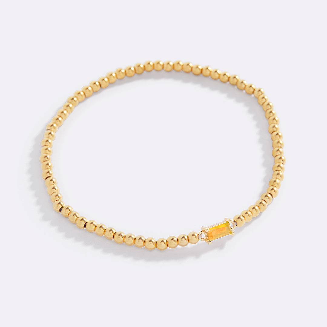 Pulsera de cuentas de oro con piedra natal