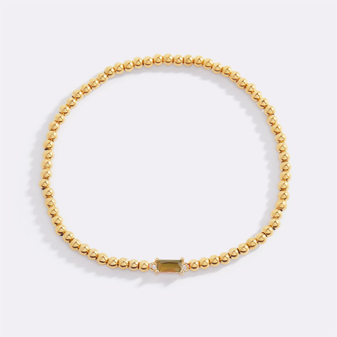 Pulsera de cuentas de oro con piedra natal