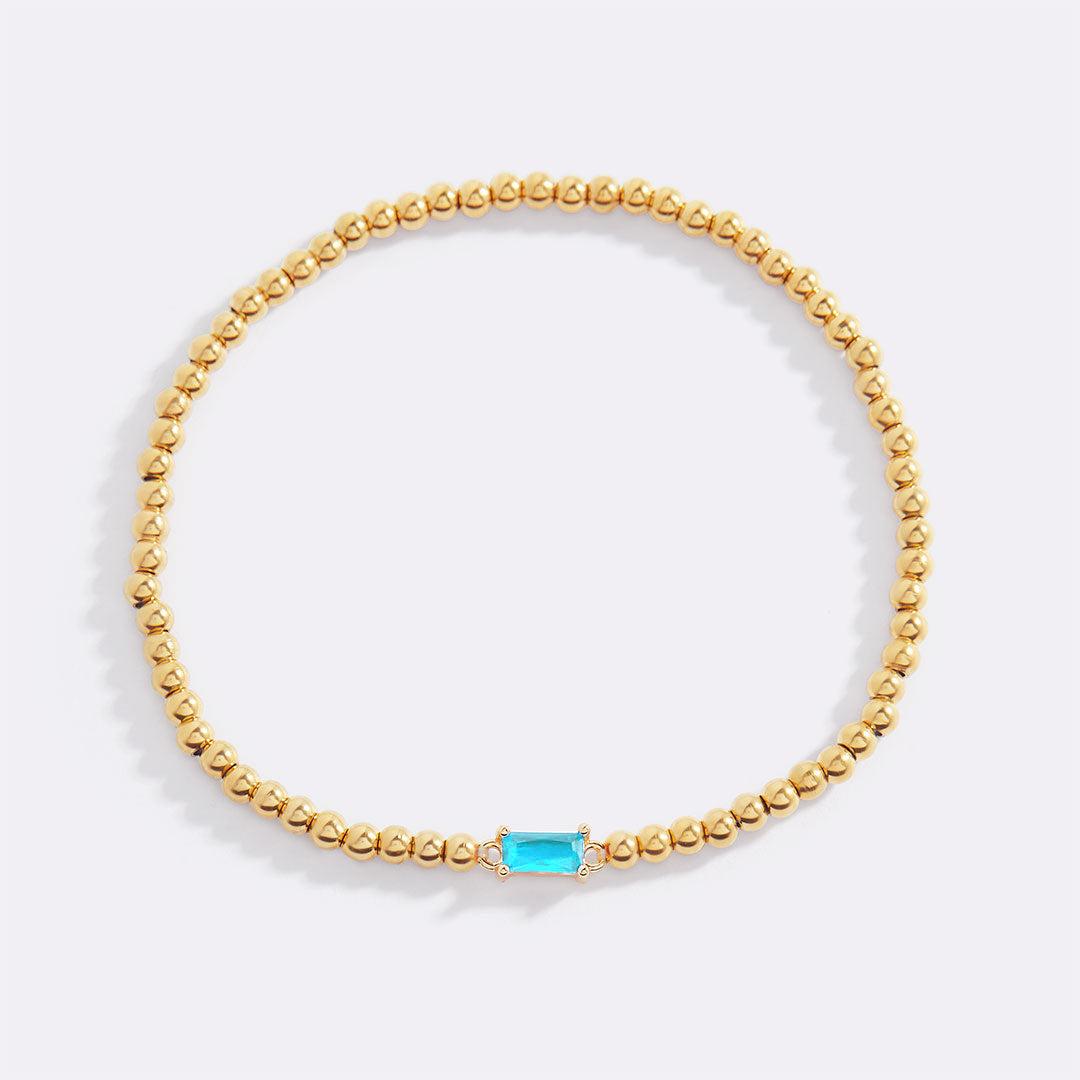Pulsera de cuentas de oro con piedra natal