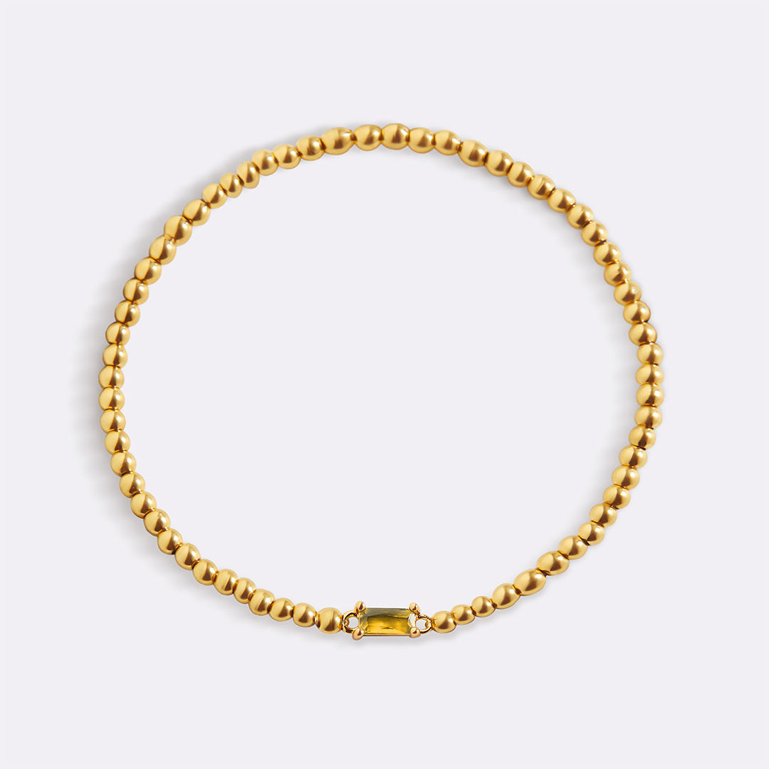 Pulsera de cuentas de oro con piedra natal