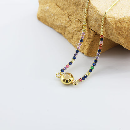Pulsera de proyección de circonitas de color