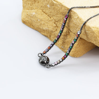 Pulsera de proyección de circonitas de color